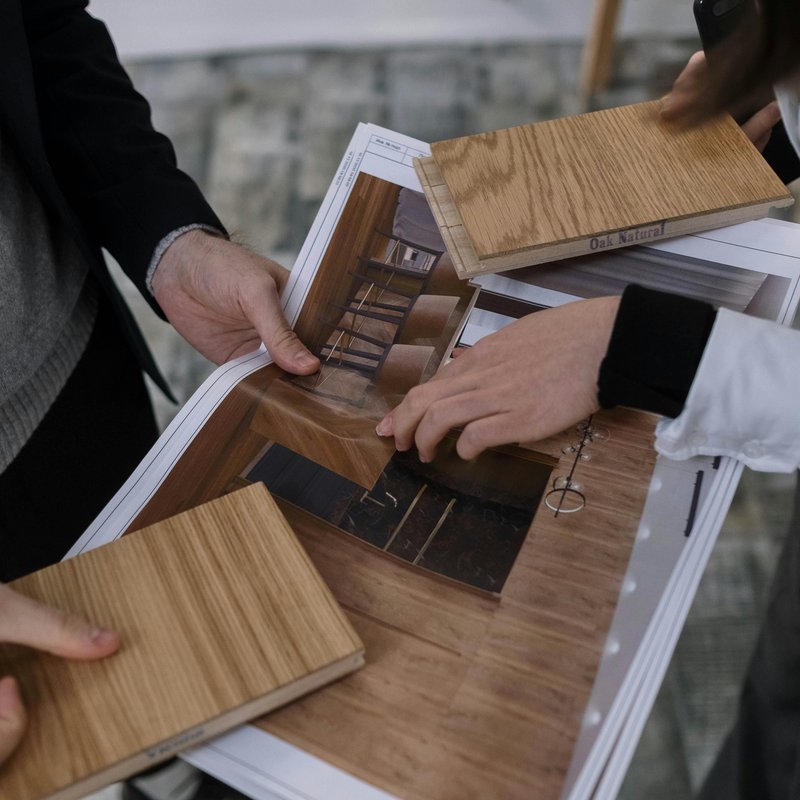 Flooring design consultation with material samples and interior design guidance