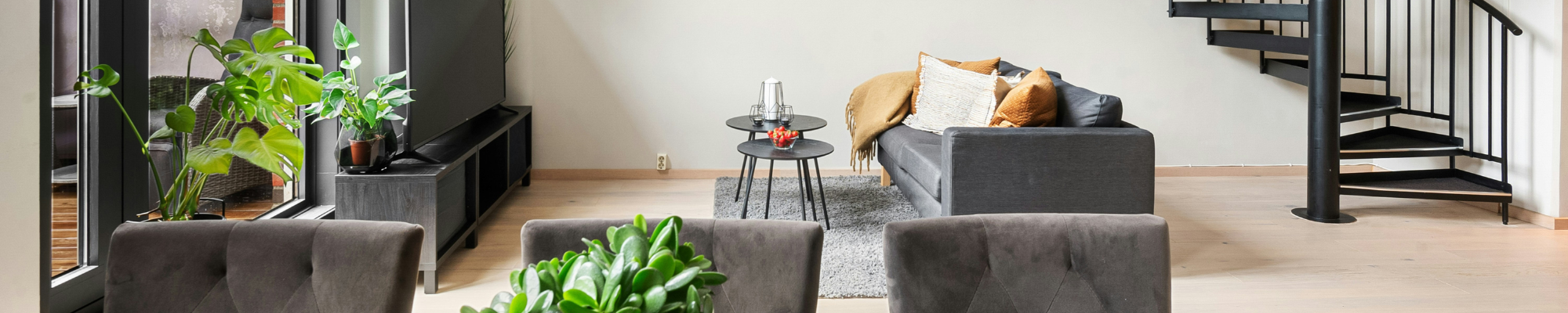 Living room with professionally installed hardwood flooring in a modern home interior