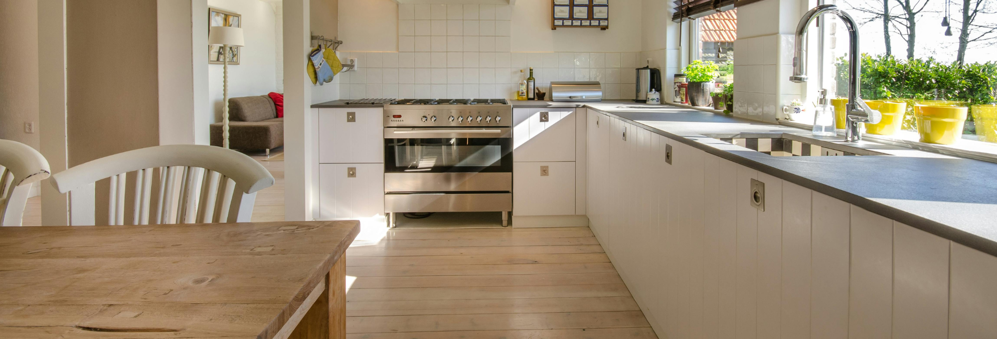 Bright kitchen interior with custom cabinetry and stone countertops